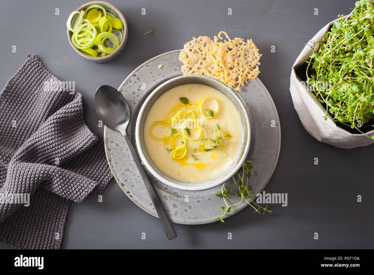 creamy potato and leek soup in bowl Stock Photo