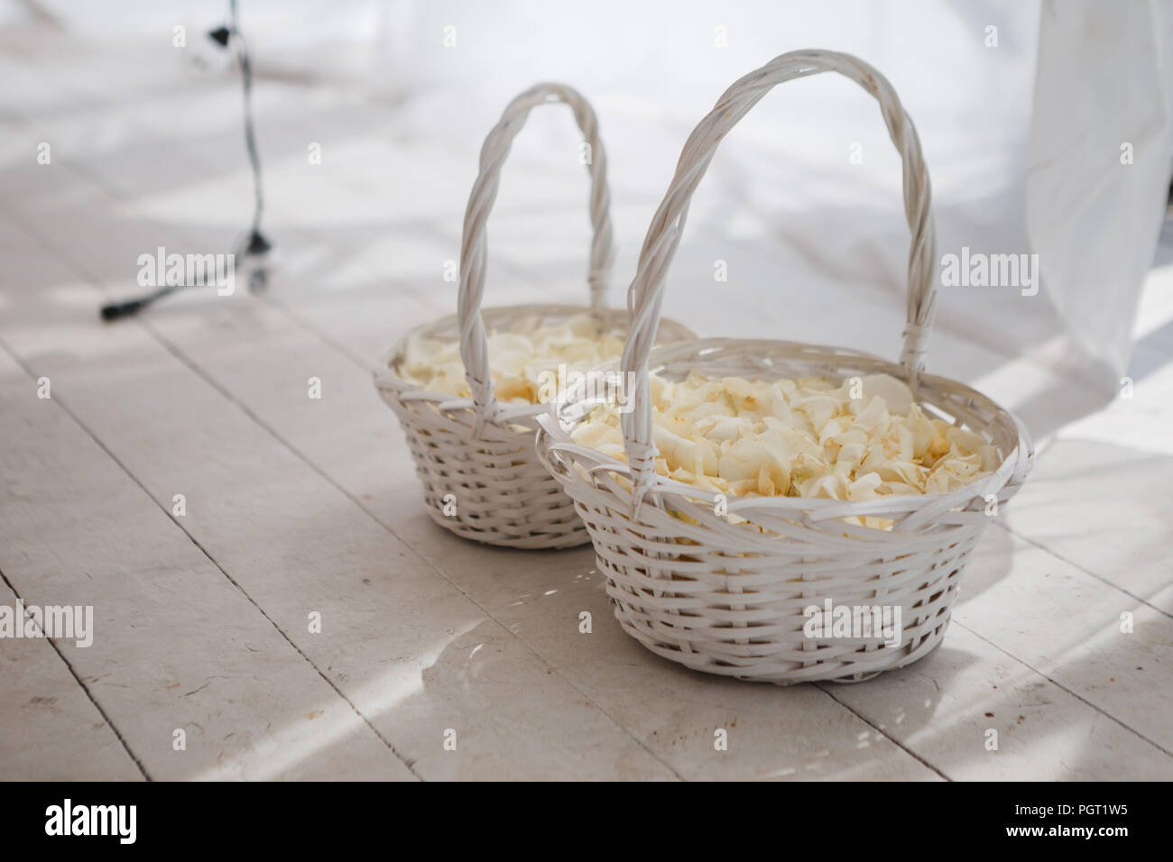 white wicker baskets with rose petals for wedding ceremony Stock Photo