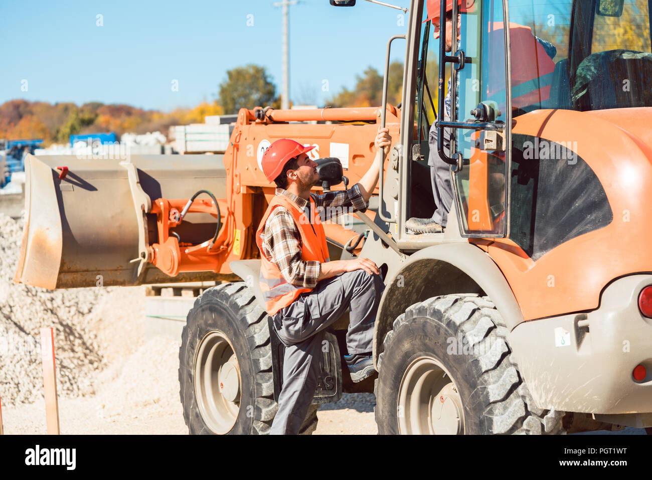 Wheel loader with tipup bucket on construction site Stock Photo Alamy