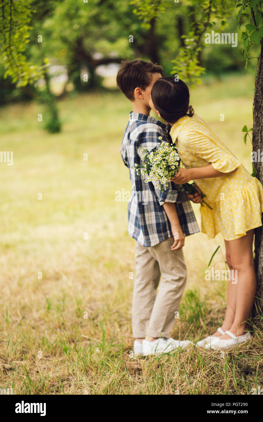 Little girl kissing boy. Stock Photo