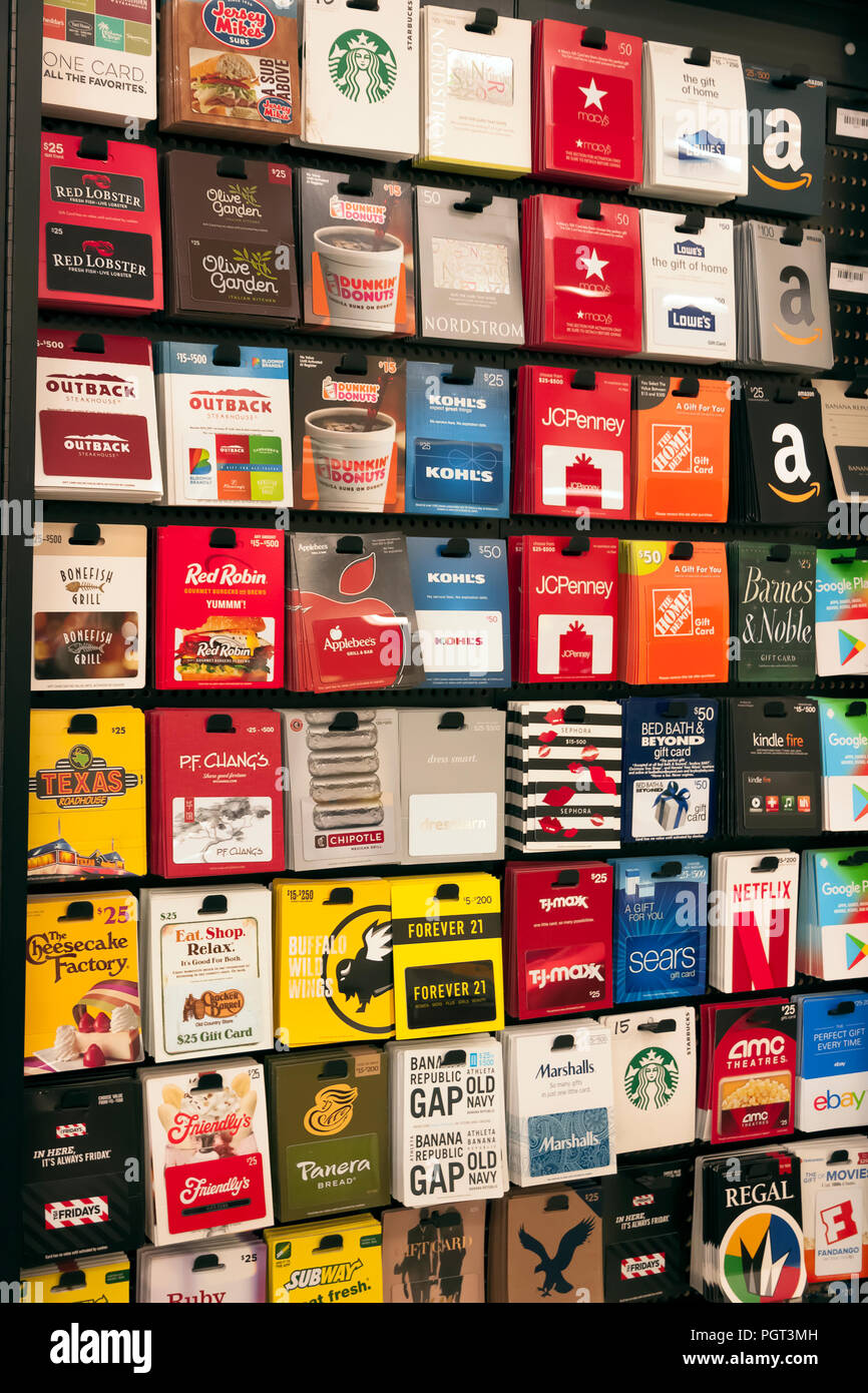 Various gift cards on display on a store rack. Stock Photo