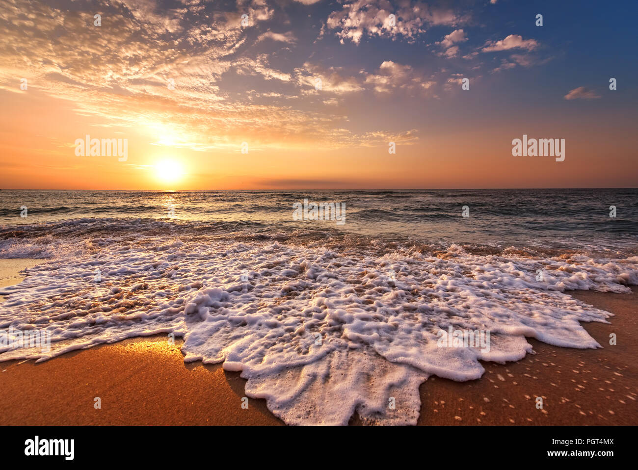 Beautiful tropical sunrise on the beach Stock Photo - Alamy