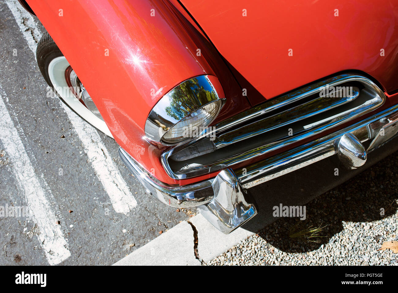 A view of a rare classic vintage American car in a parking lot Stock