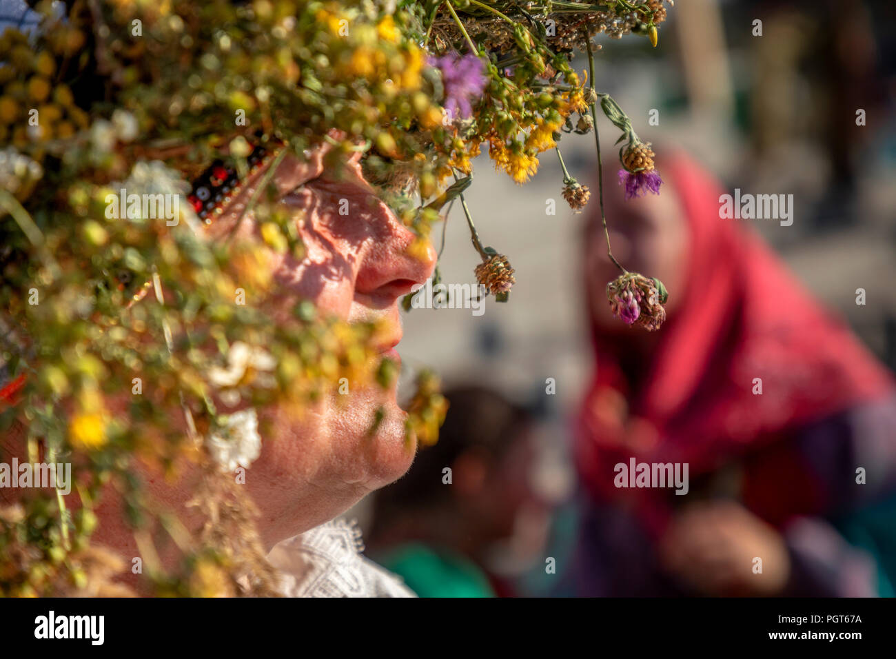 Girls in Russian sarafans and with flower wreaths on their heads during a village holiday Stock Photo