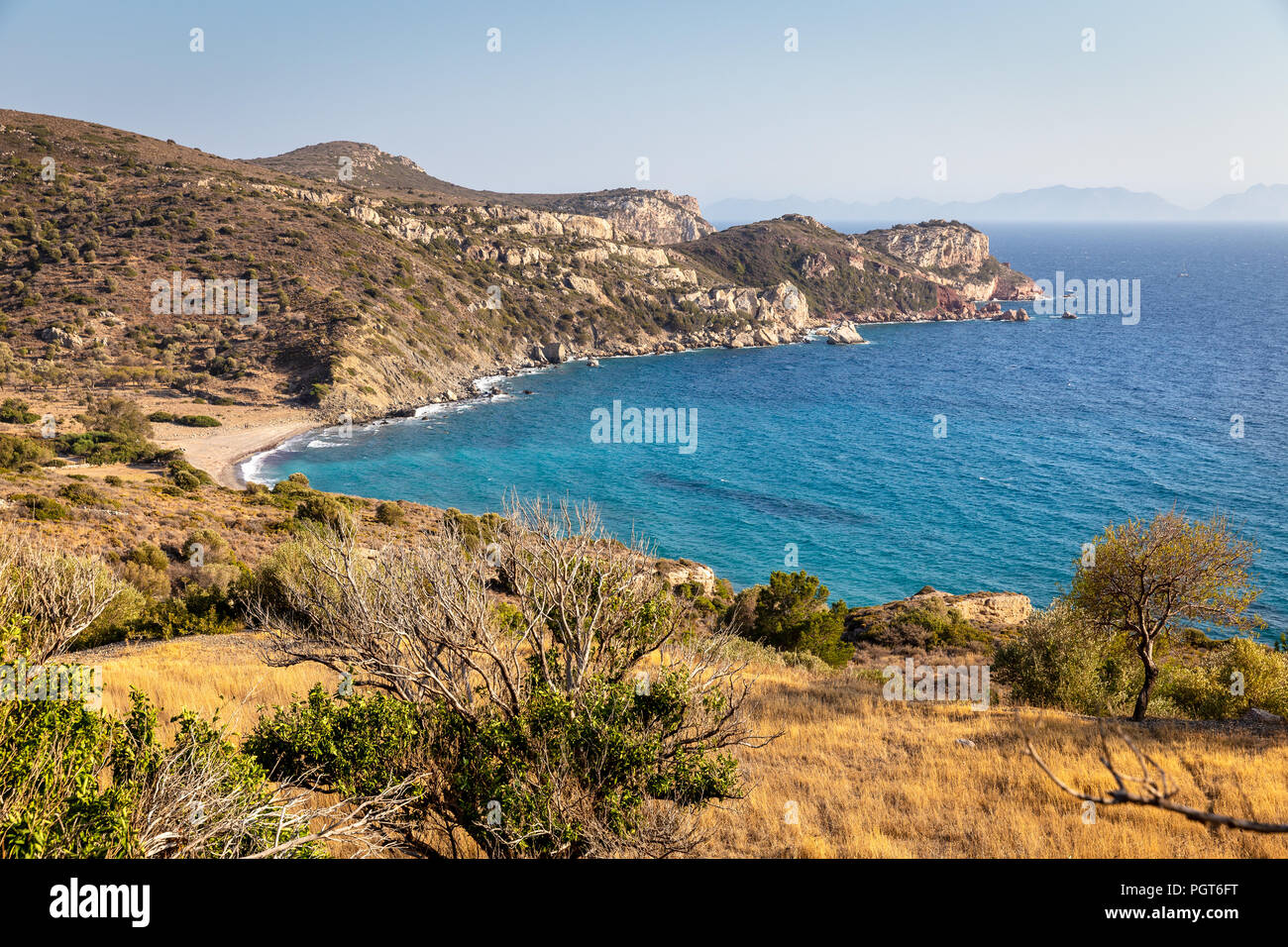 Undiscovered paradise beach with emerald waters on the way the historic city of Knidos in Datca peninsula, Mugla,Turkey. Stock Photo