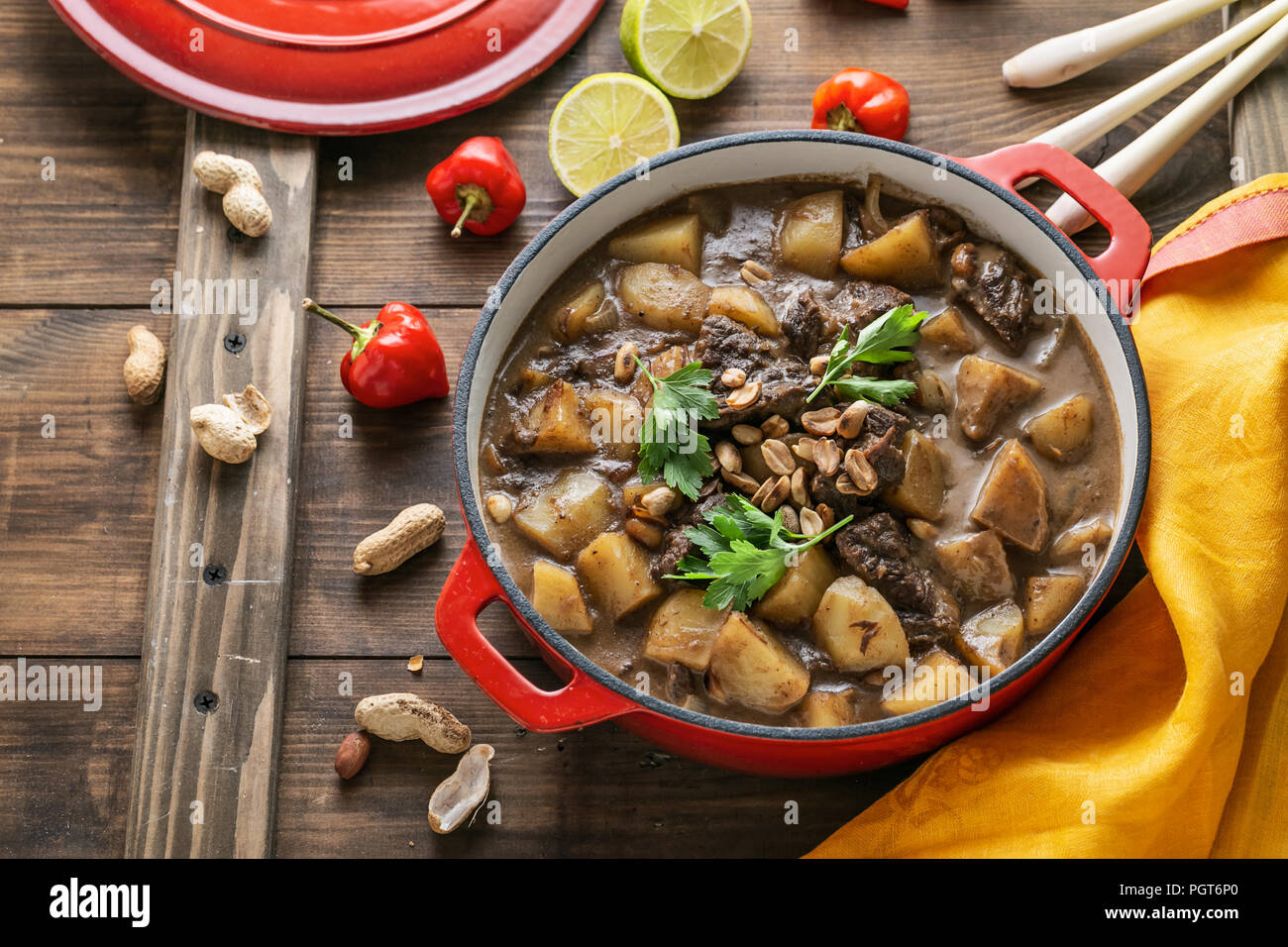 Massaman curry with beef and potato on wooden background Stock Photo