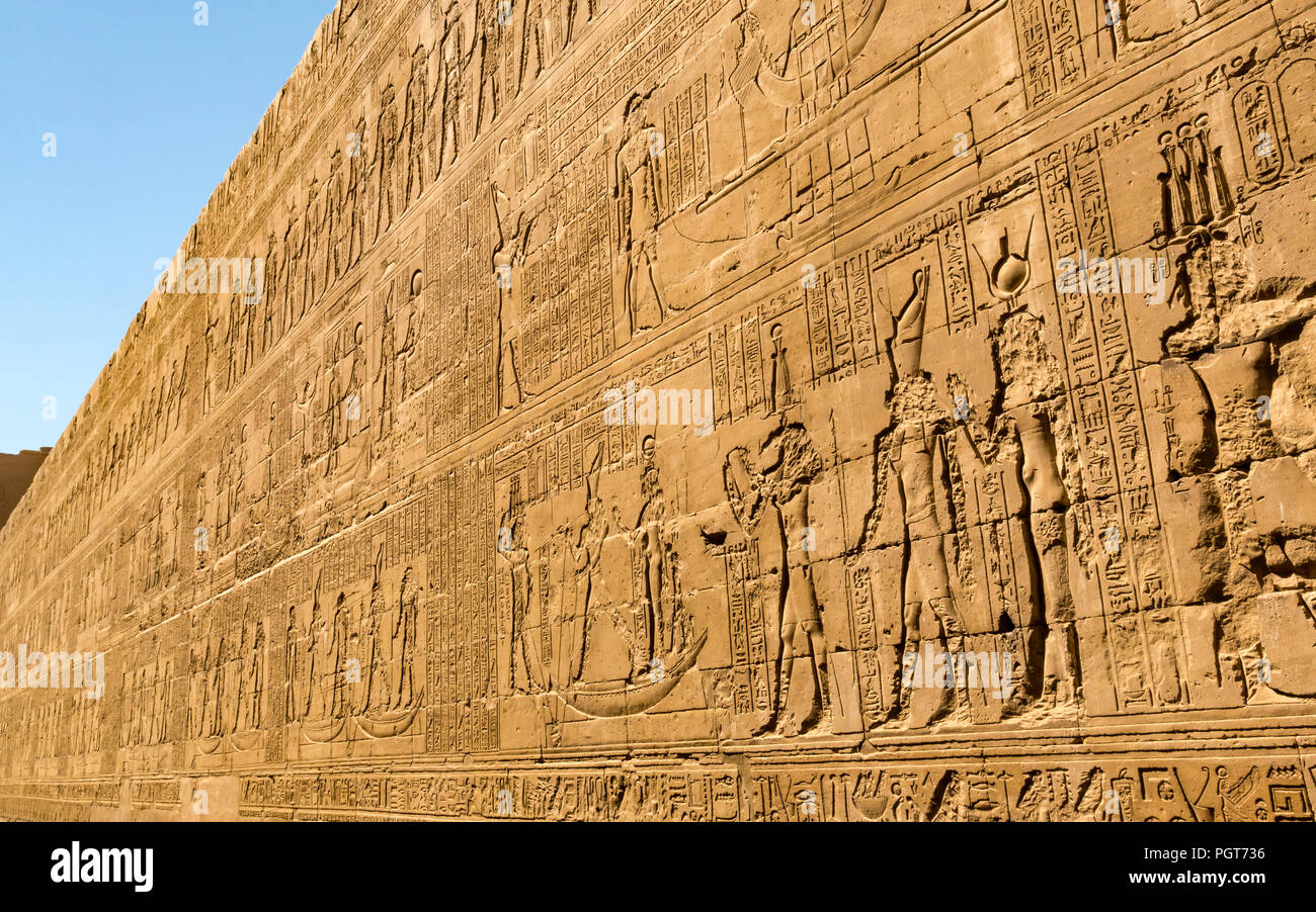 Long high outer wall covered in carved Egyptian hieroglyphs, Temple of Edfu, Edfu, Egypt, Africa Stock Photo