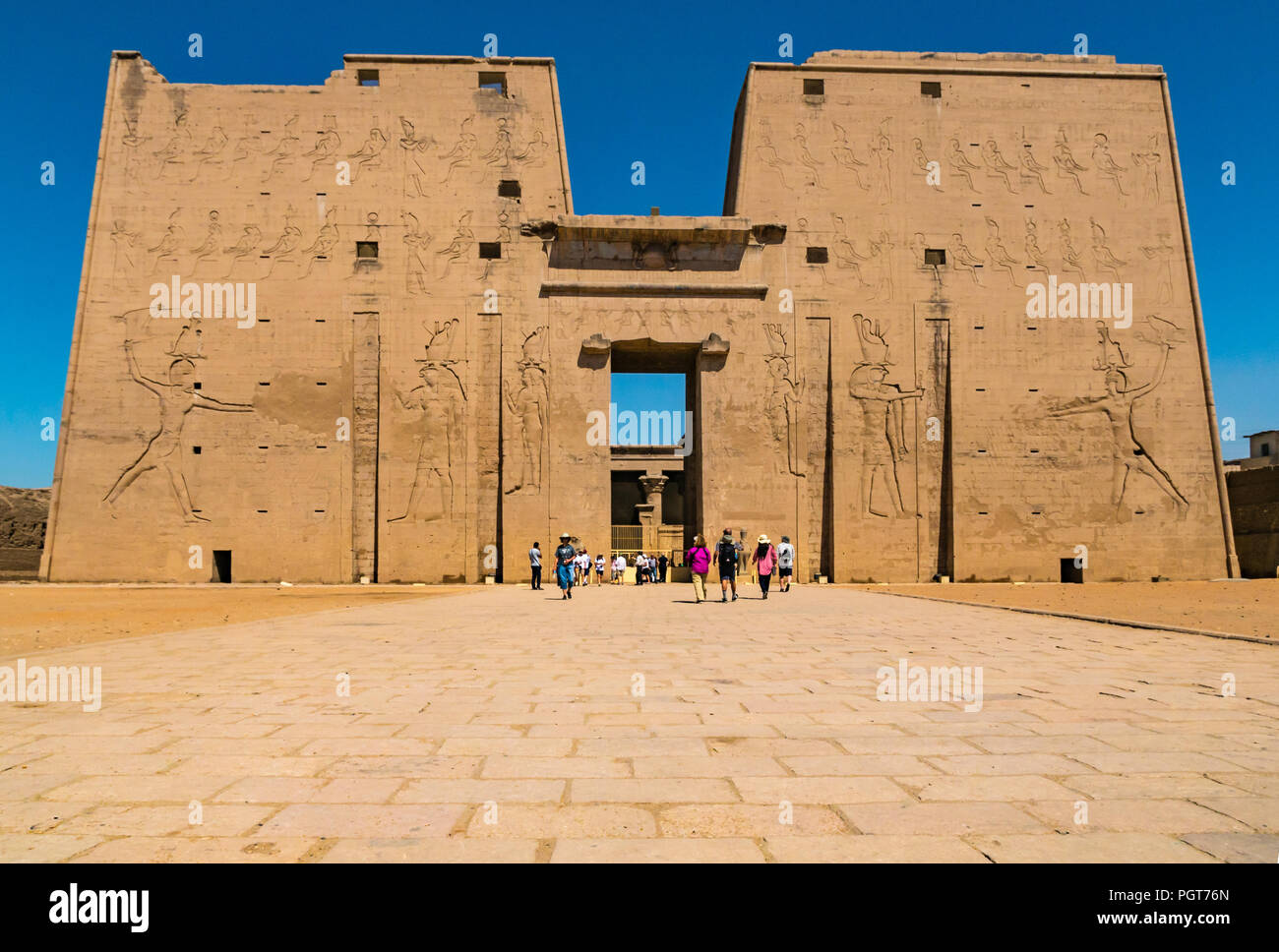Carved Egyptian figure hieroglyphs on outer entrance pylon, gateway of