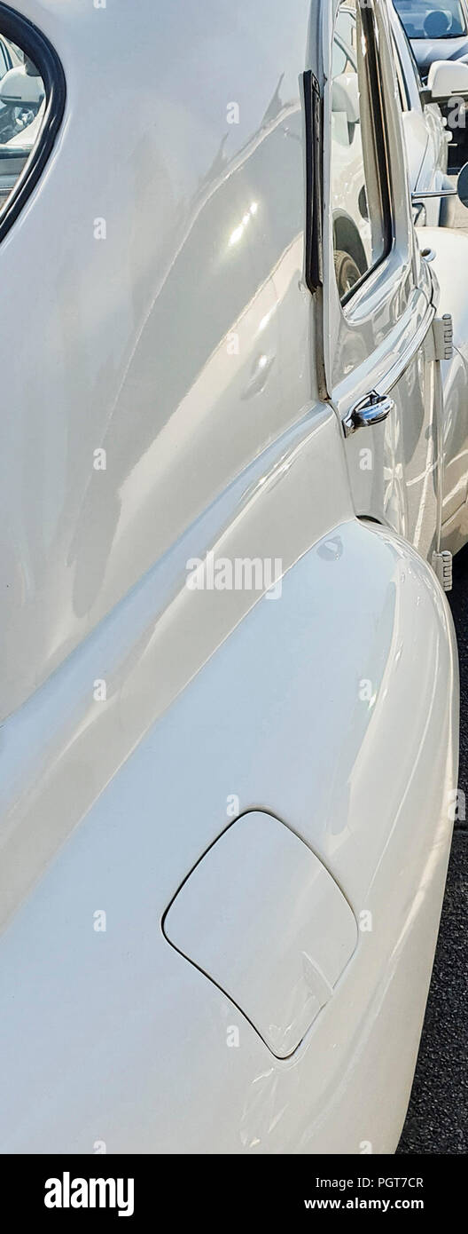 Image of the fuel tank cap installed on the rear mudguard of a Peugeot 203, 1950 model, on the streets of the city of Melbourne, Australia Stock Photo