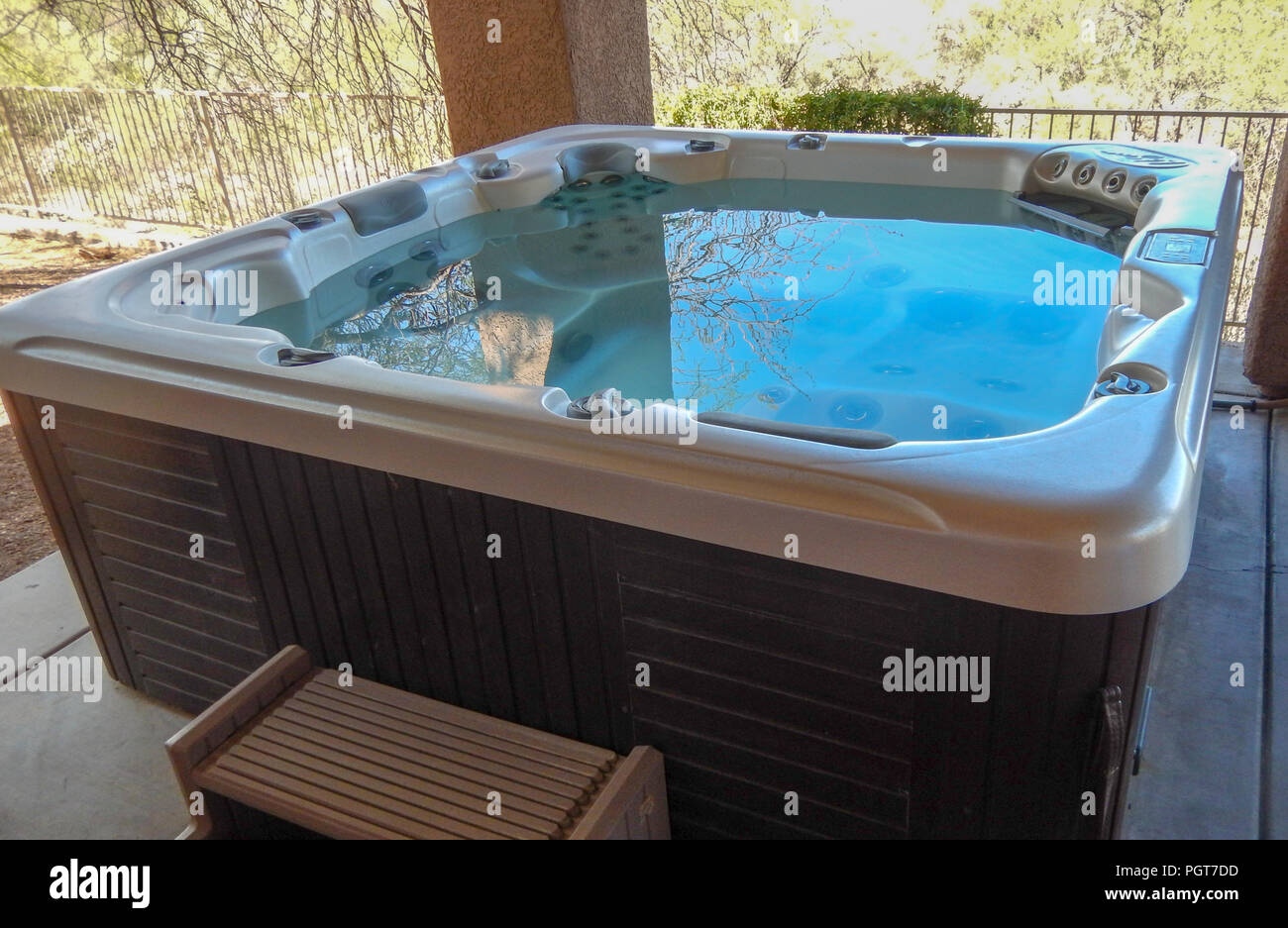 Hot tub on patio full of warm water Stock Photo Alamy