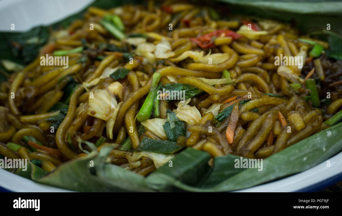 Spicy Stir Fried Noodles With Veggies And Assortment Of Asian Sauces Served Close Up And Called Mie Kenyol In Indonesia Central Java Stock Photo Alamy