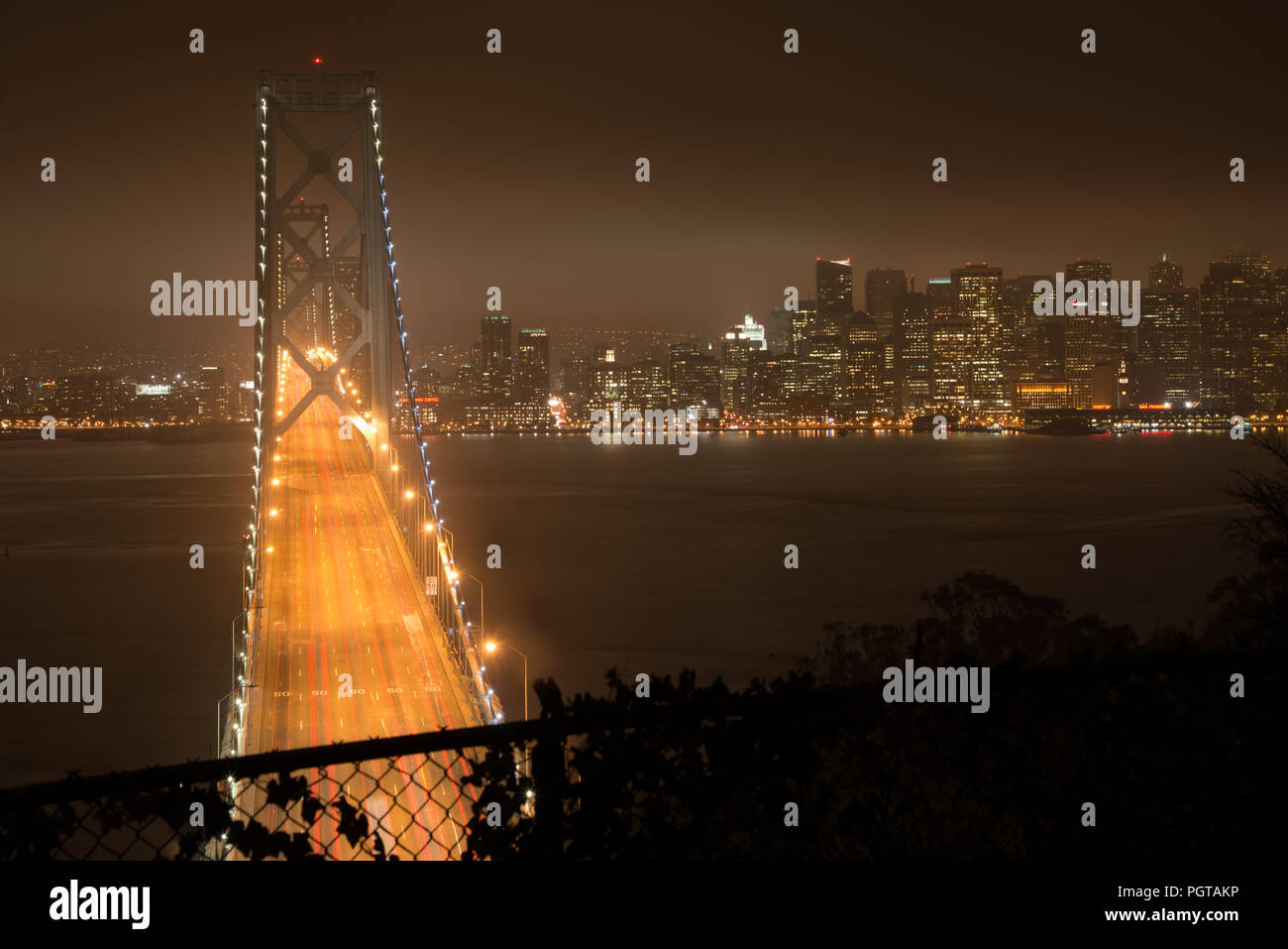 Elevated view of the Bay Bridge lit up at night, San Francisco, North Beach, California, USA Stock Photo
