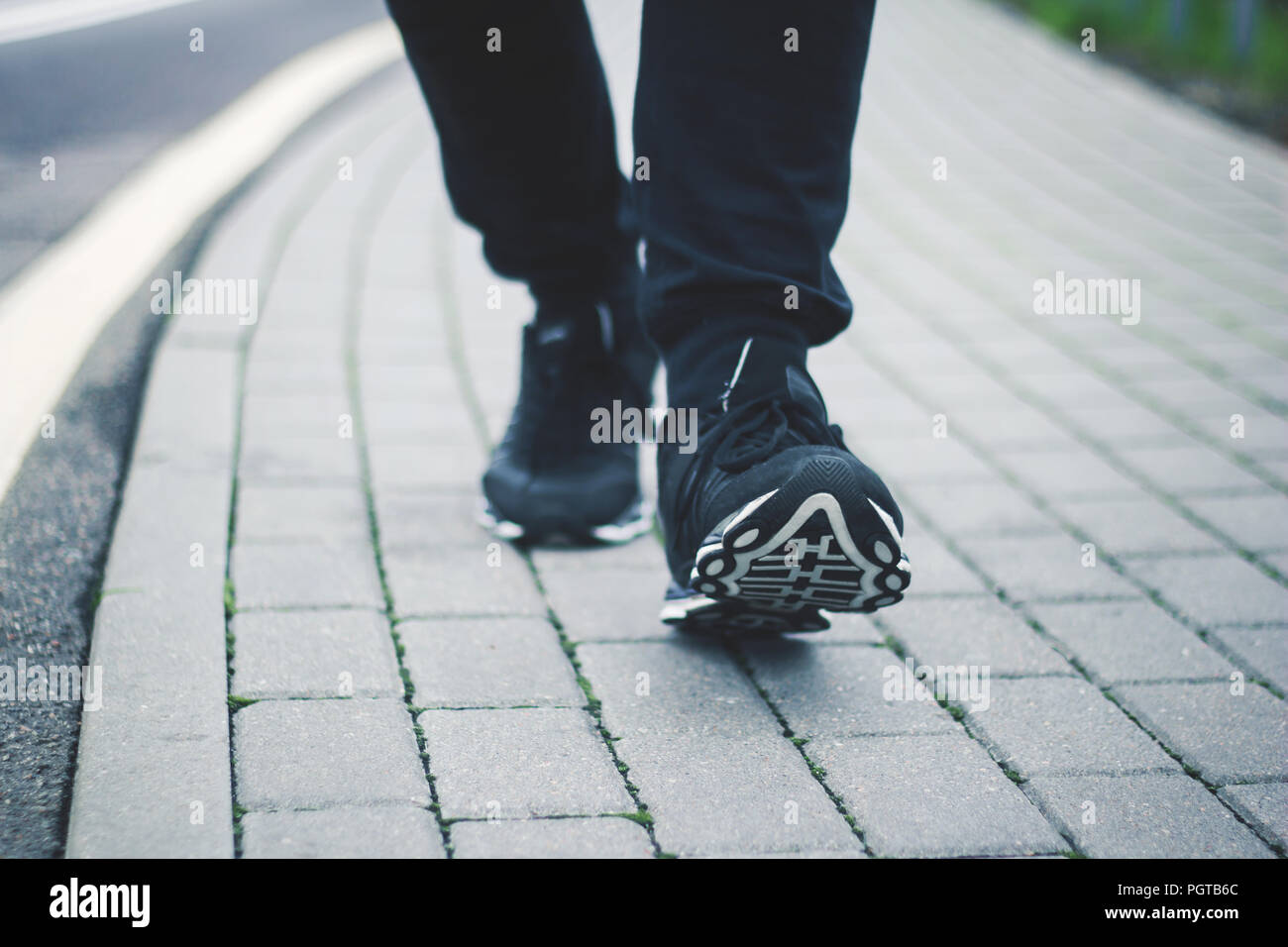 closeup.the feet of people walking on the pavement in winter Stock