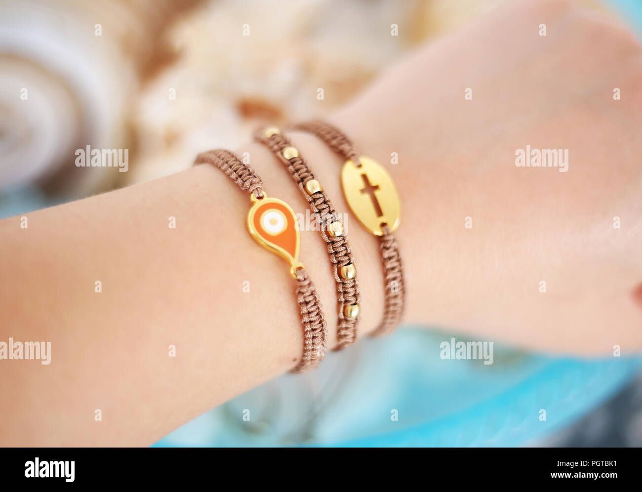 Hand wearing bracelets hi-res stock photography and images - Alamy