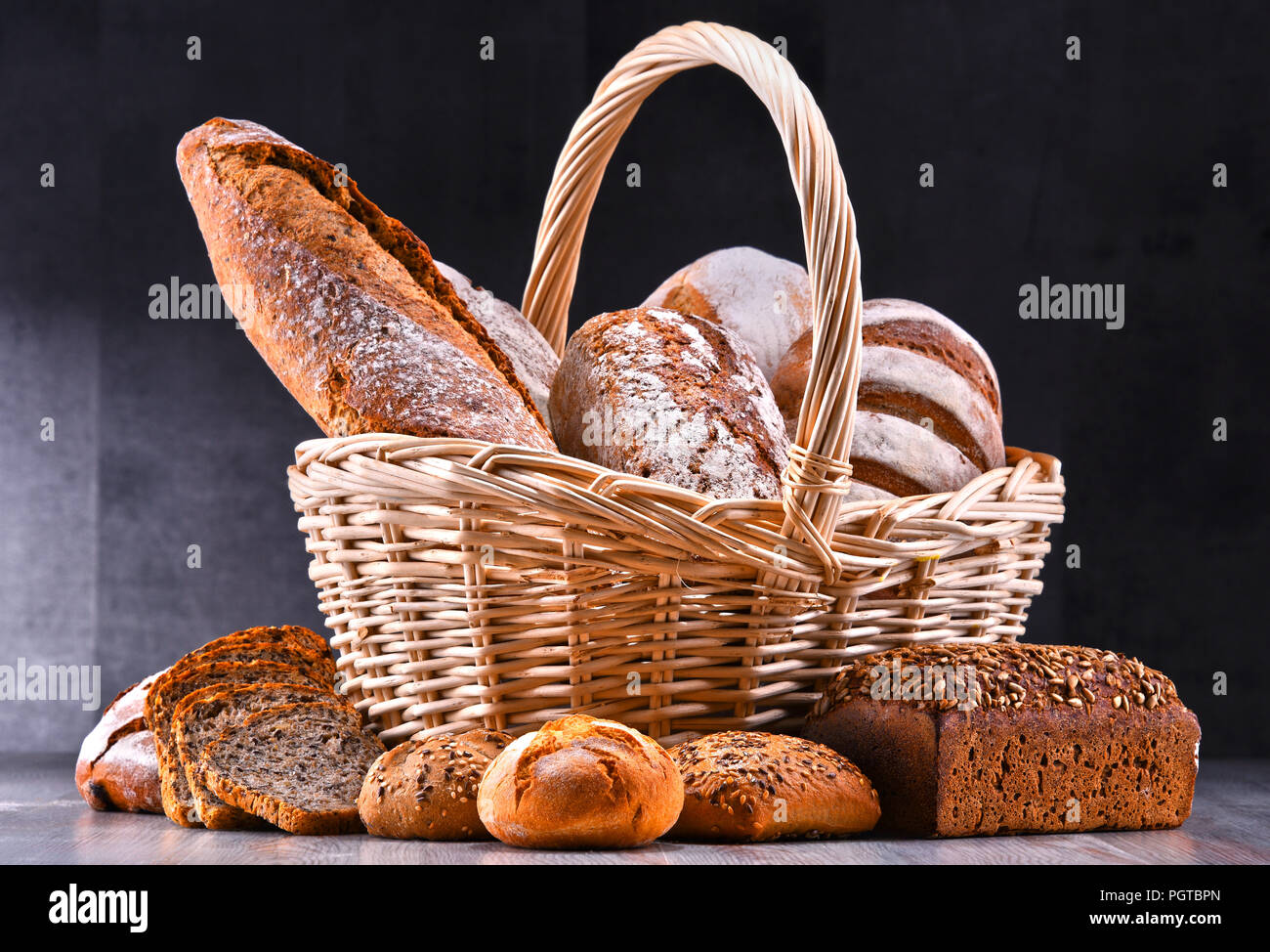Composition with assorted bakery products in wicker basket Stock Photo