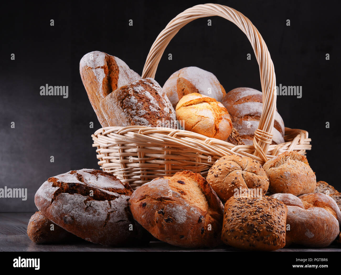Composition with assorted bakery products in wicker basket Stock Photo
