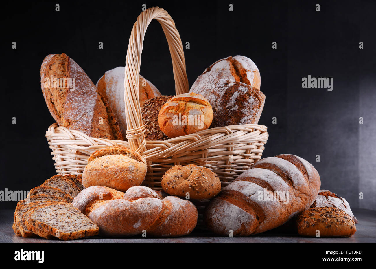 Composition with assorted bakery products in wicker basket Stock Photo