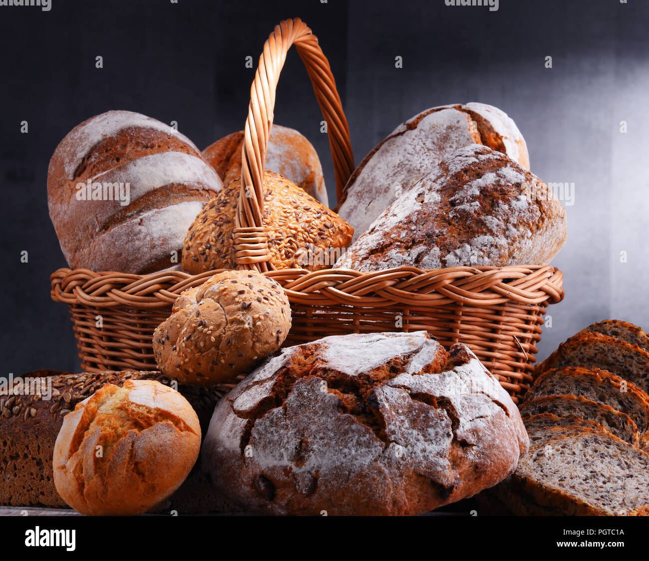 Composition with assorted bakery products in wicker basket Stock Photo