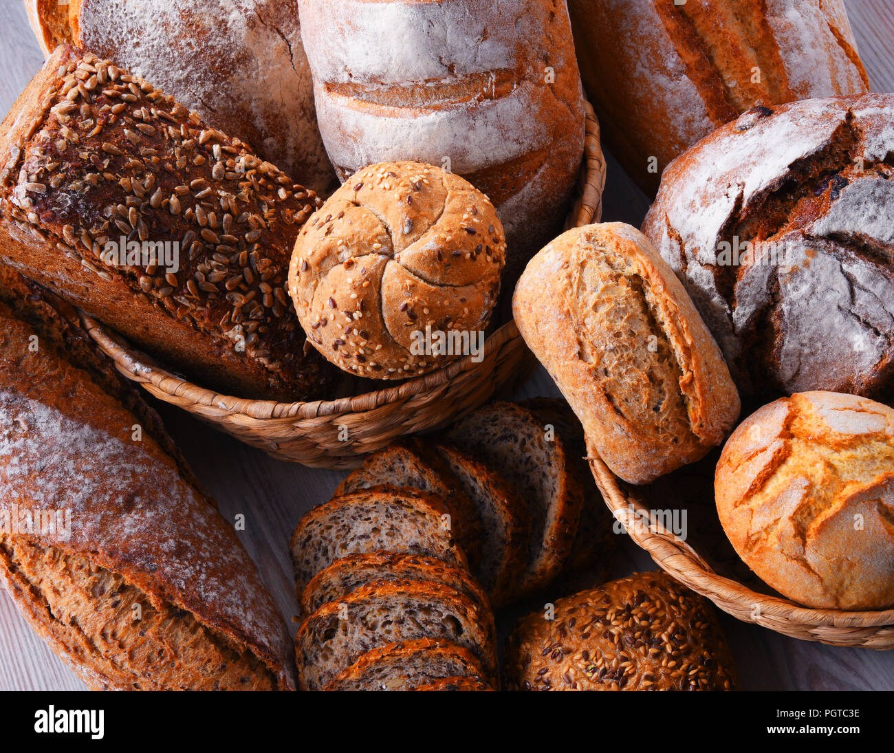 Composition with assorted bakery products in wicker basket Stock Photo