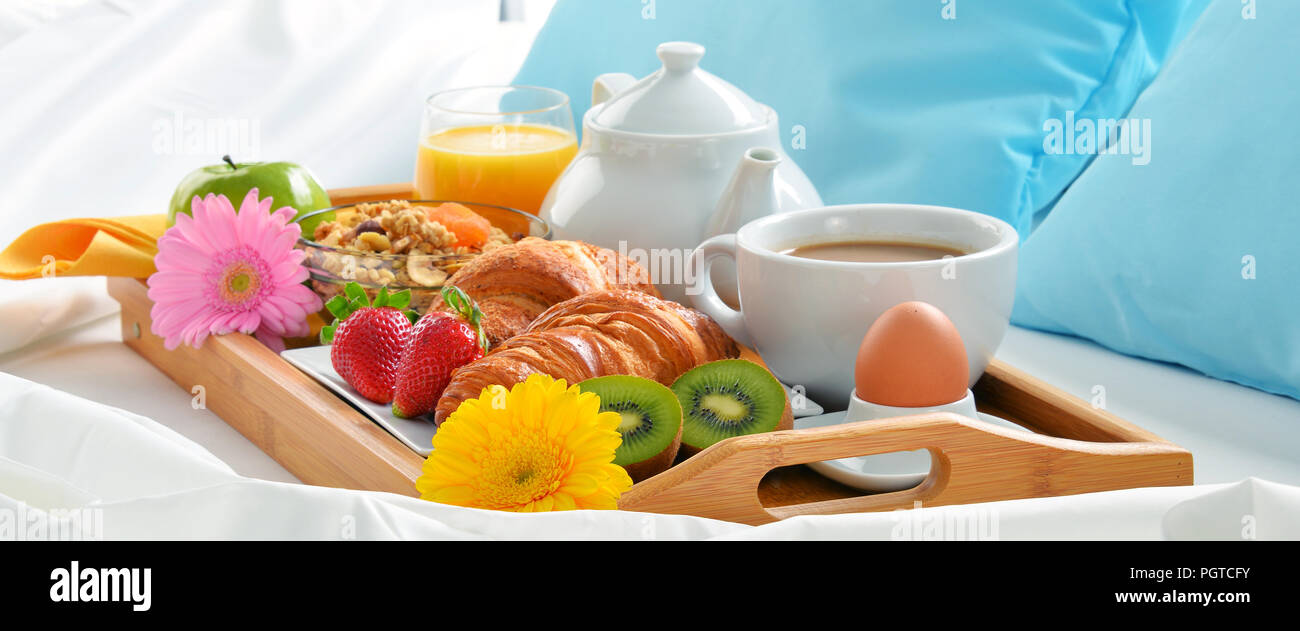 Breakfast tray in bed in hotel room Stock Photo - Alamy