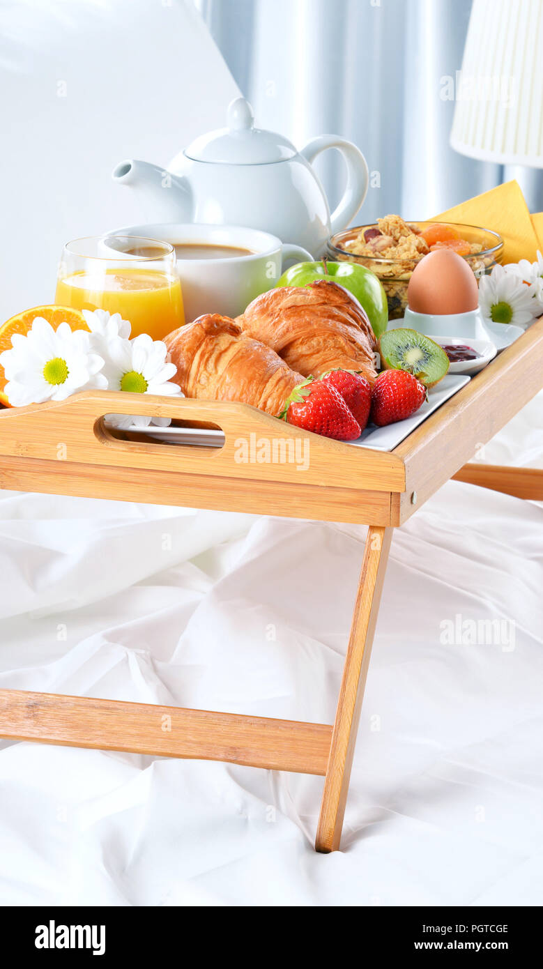 Breakfast tray in bed in hotel room Stock Photo - Alamy