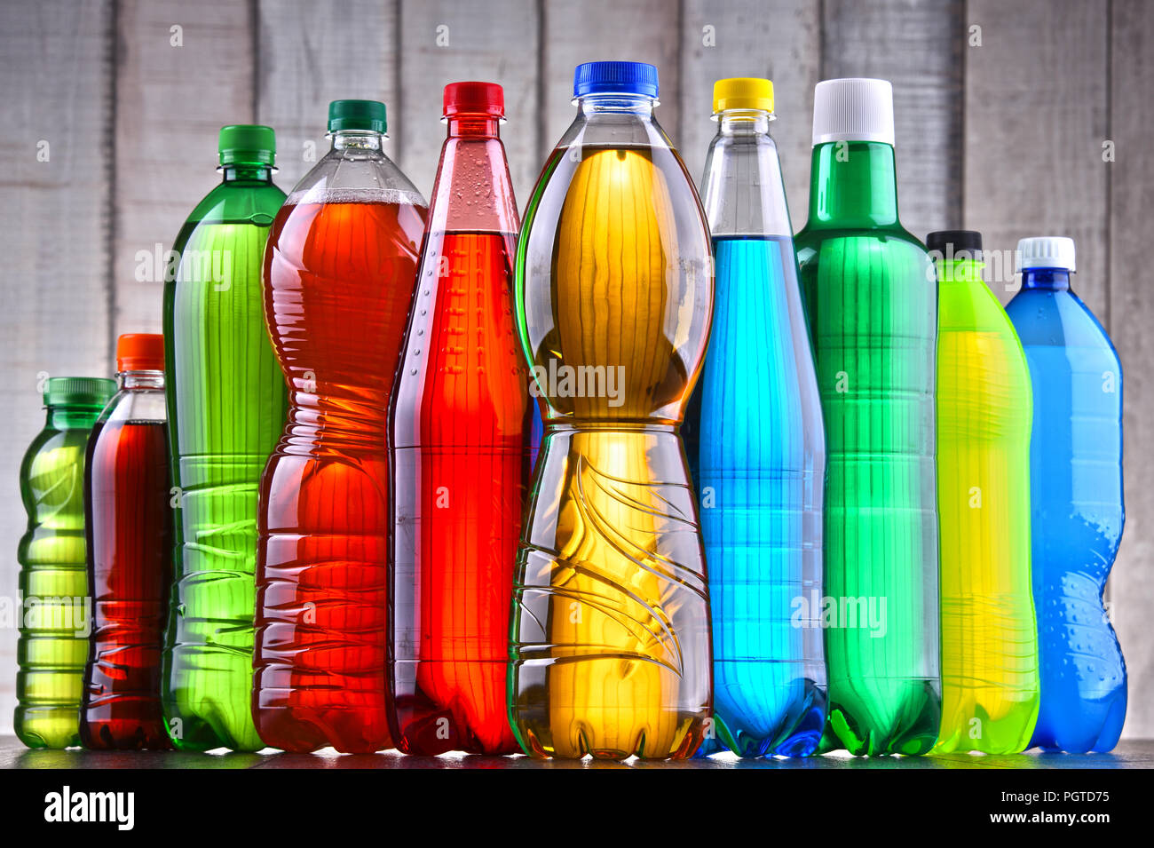 Plastic bottles of assorted carbonated soft drinks in variety of colors