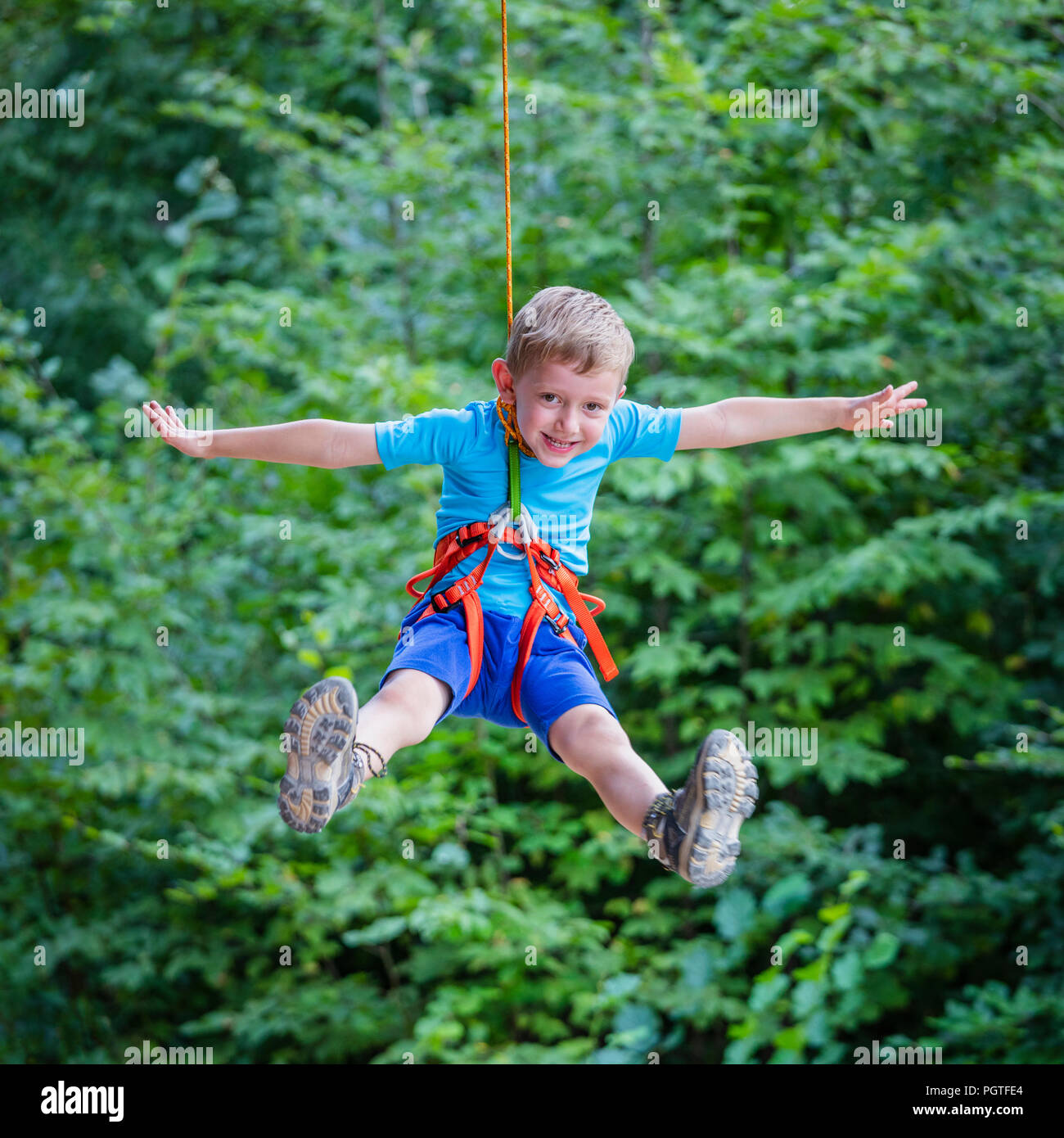 kid has fun in adventure park Stock Photo