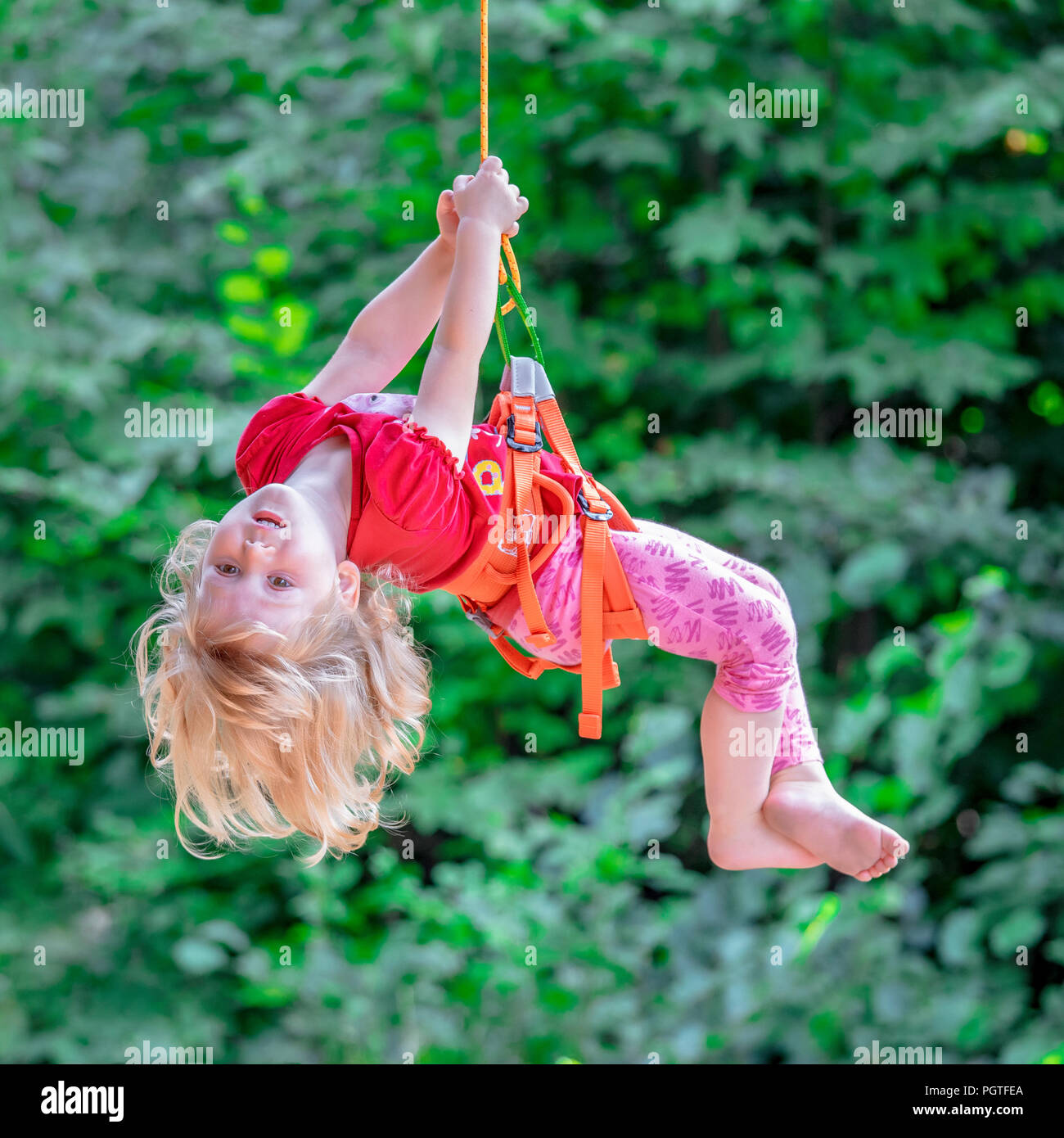 kid enjoy childhood in adventure park Stock Photo