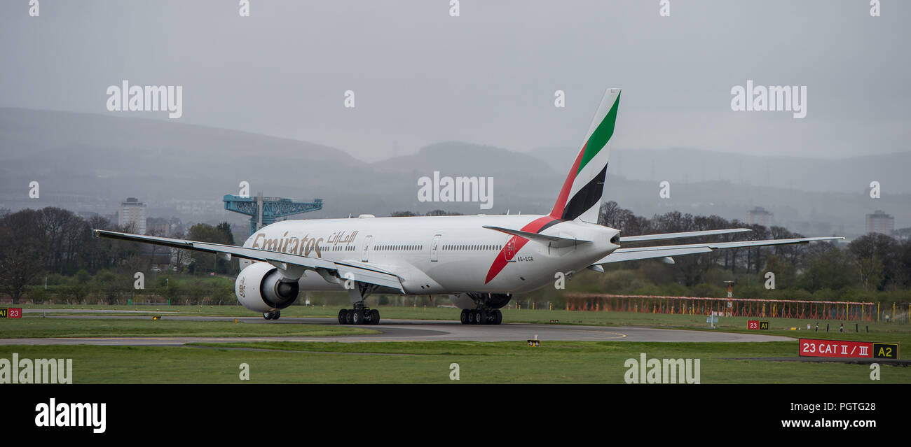 Emirates Boeing 777 Dubai flight seen at Glasgow International Airport, Renfrewshire, Scotland. Stock Photo