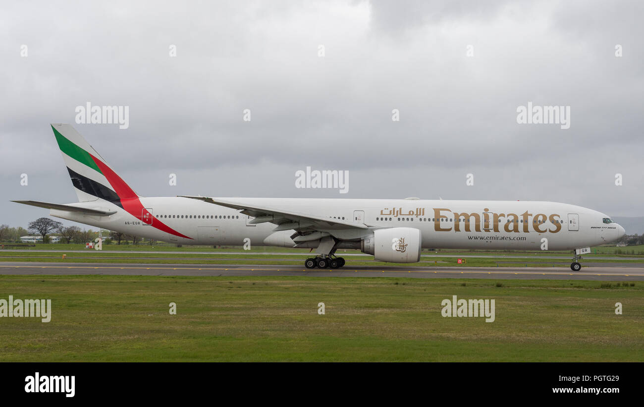Emirates Boeing 777 Dubai flight seen at Glasgow International Airport, Renfrewshire, Scotland. Stock Photo