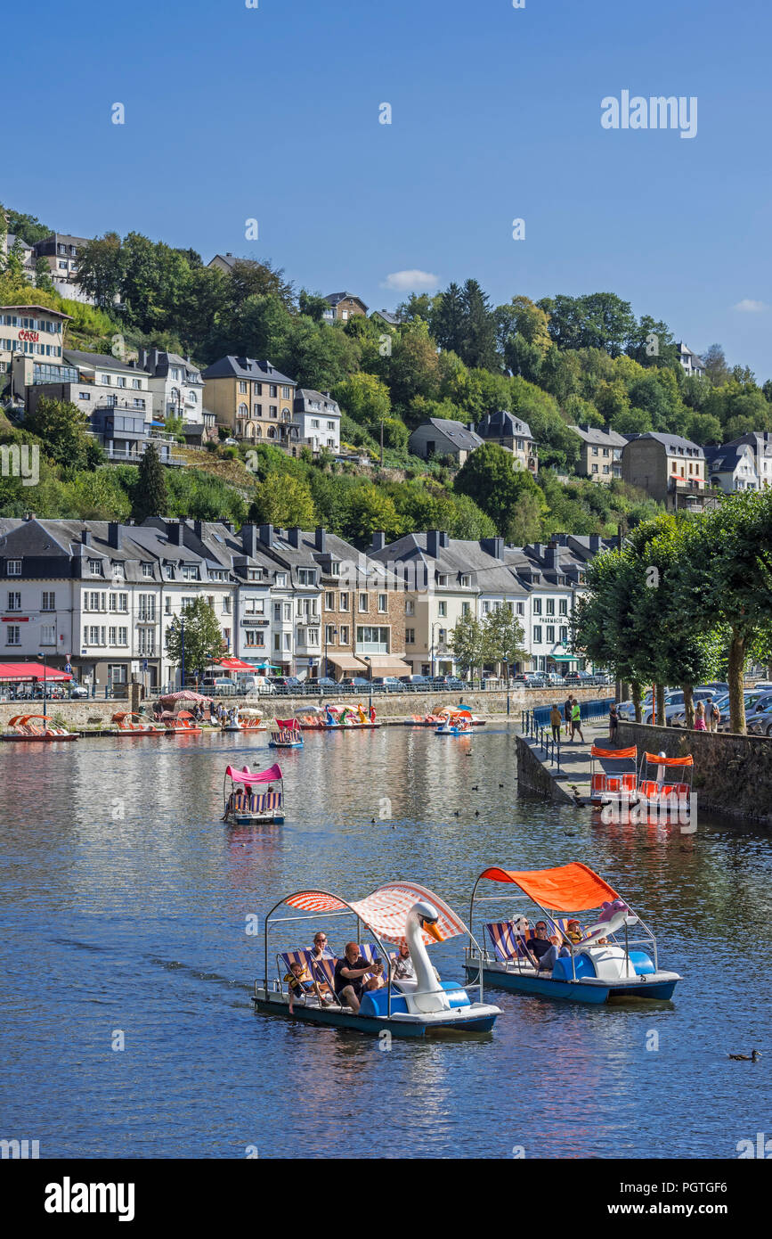 Paddle boats with tourists on the Semois river in the city Bouillon in summer, Luxembourg