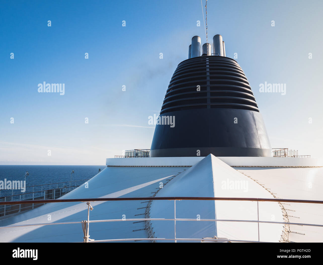 Cruise liner on the background of the coastline and clear blue sky Stock Photo