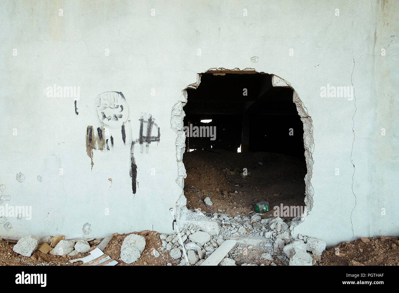 The entrance of an ISIS hiding place the training bullet holes in Qaraqosh  the christian city destroyed by ISIS Stock Photo - Alamy