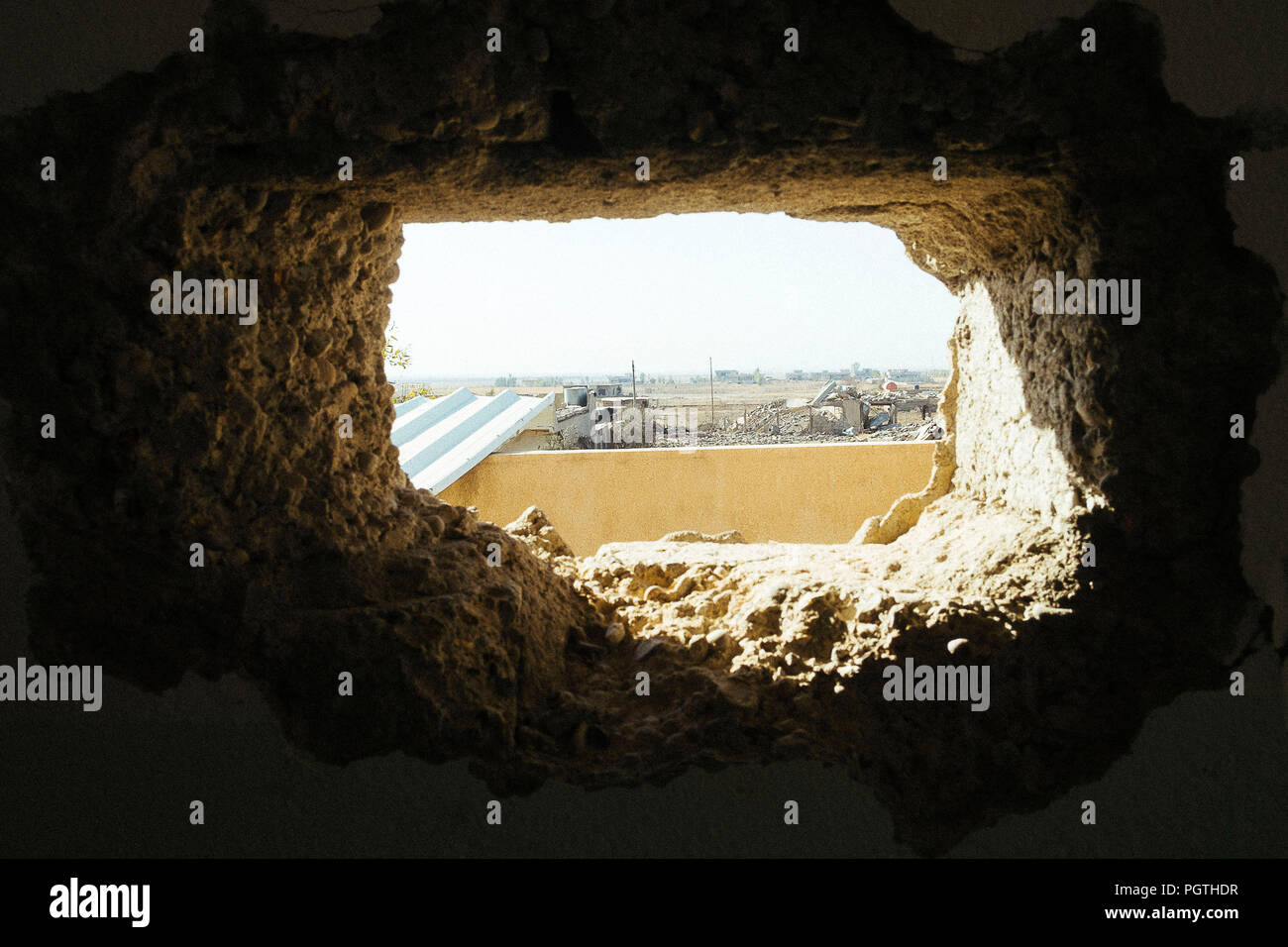 Panorama from a sniper hole inside an ISIS hiding place in Qaraqosh the christian city destroyed by ISIS Stock Photo