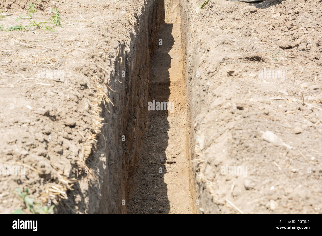Providing safety for the installation of a new sewage pipe. Sewerage construction. Stock Photo