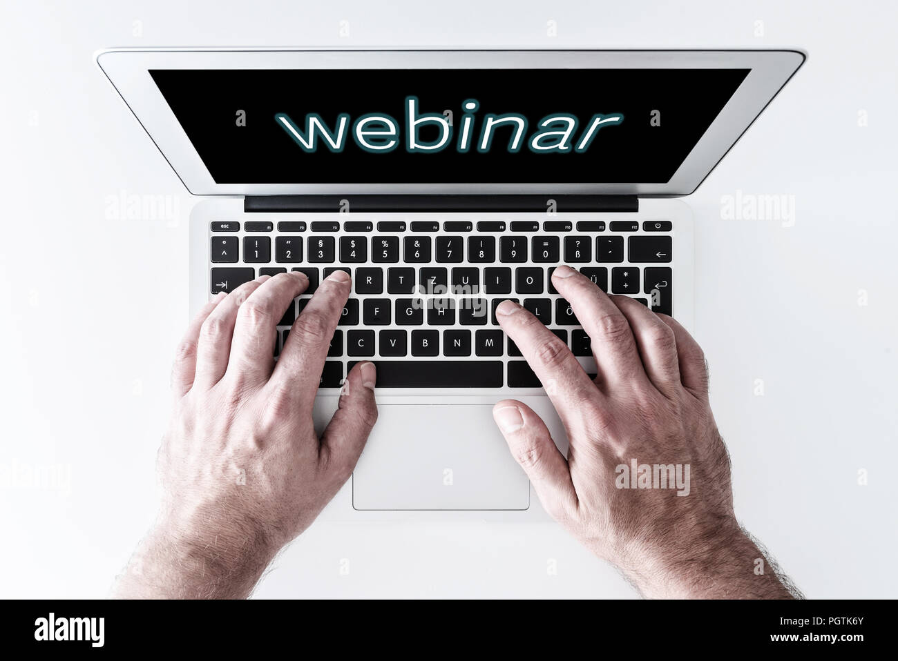 top view of laptop computer with word webinar on screen Stock Photo