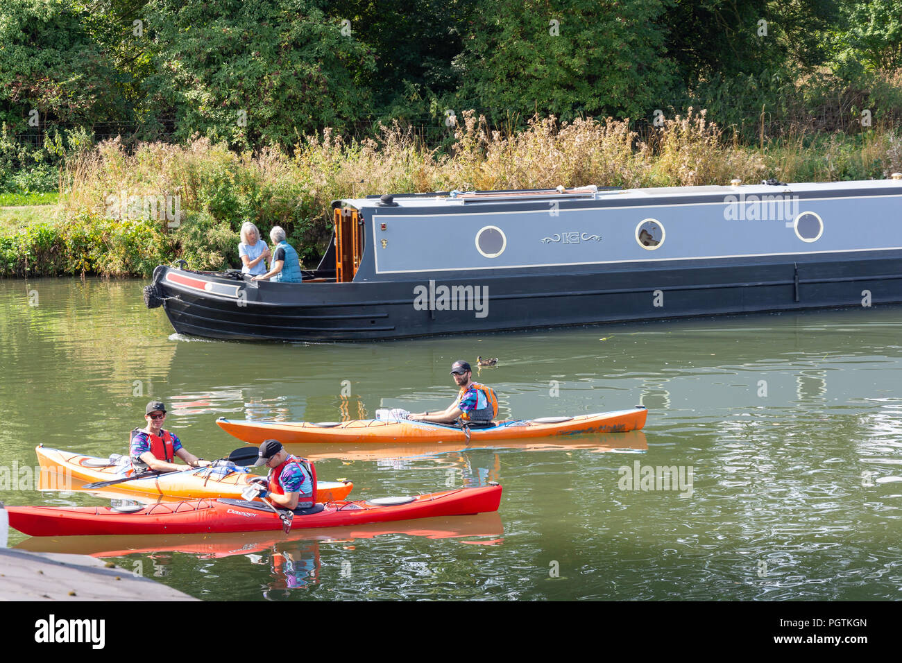 Kayaks and canal boat on River Thames, The Riverside, Lechlade-on-Thames, Gloucestershire, England, United Kingdom Stock Photo