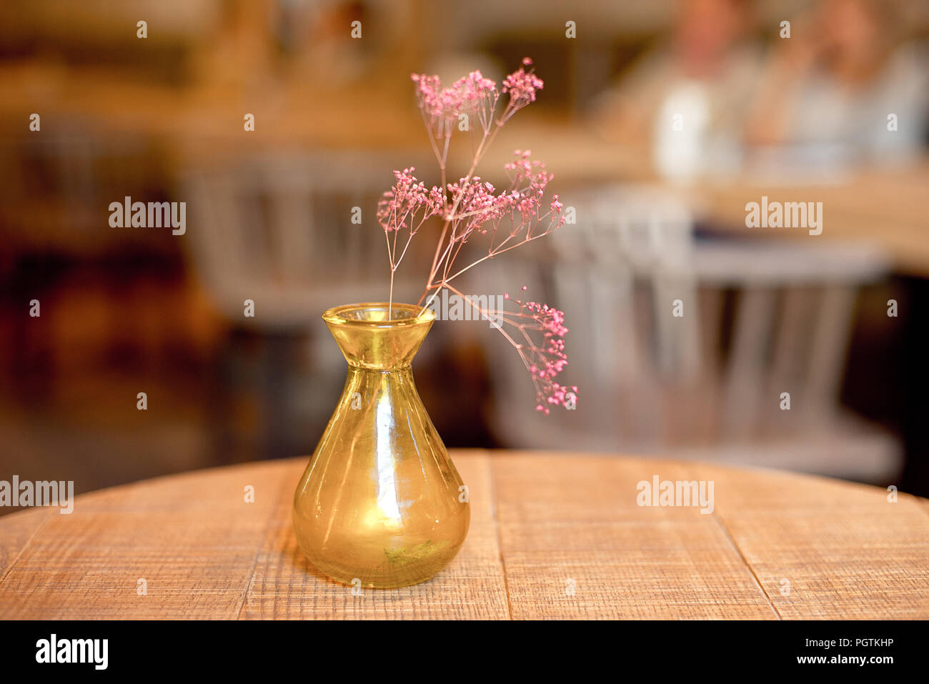Small rustic vase with flowers on the table in modern interior Stock ...