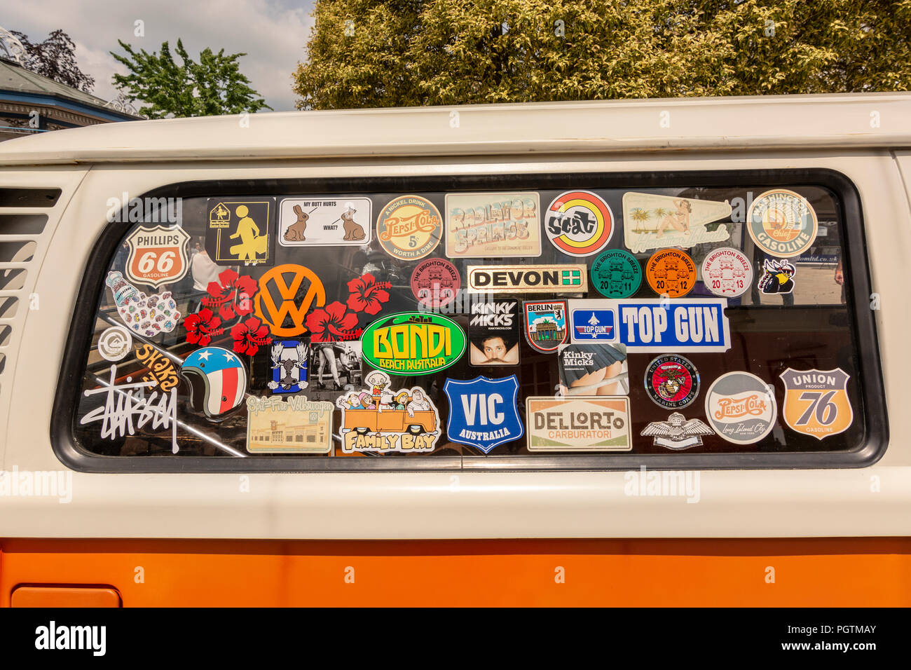Stickers spotted on a side window of a vintage Volkswagen Camper Van