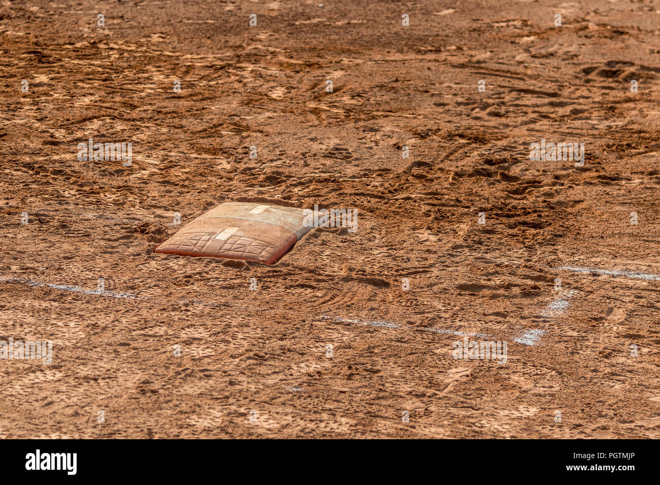 Detail of a home plate in a baseball (softball) dusty field, with copyspace Stock Photo