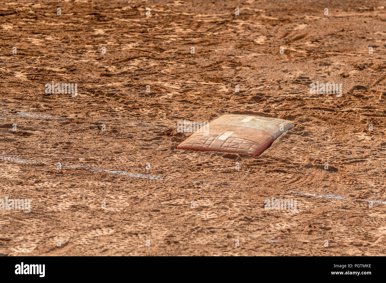 Detail of a home plate in a baseball (softball) dusty field, with copyspace Stock Photo