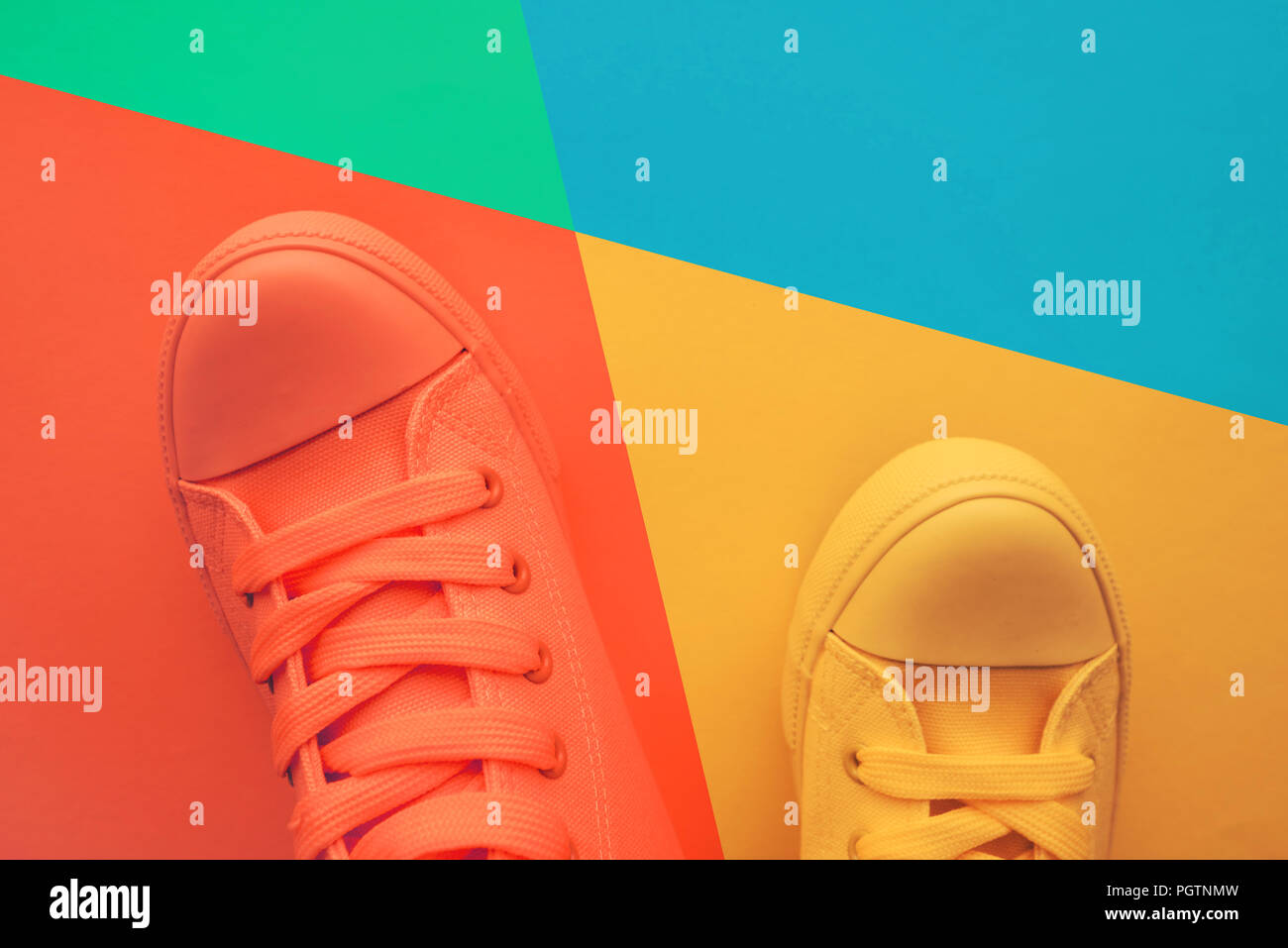 Sneaker shoes for youth lifestyle concept, pastel toned footwear with copy space, top view Stock Photo