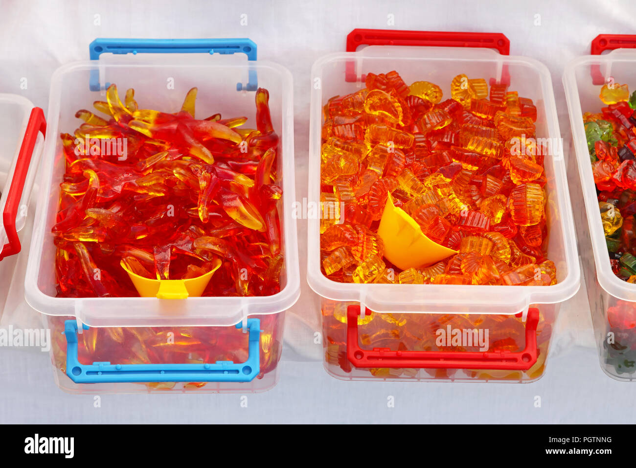 Red gummy worms in bulk boxes Stock Photo Alamy