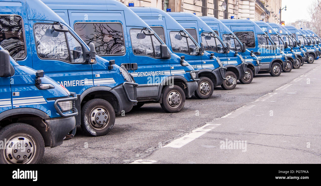 A row of blue police or gendarmerie vans parked outside the Paris Police  Prefecture on the Ile de la Cite in Paris France Stock Photo - Alamy