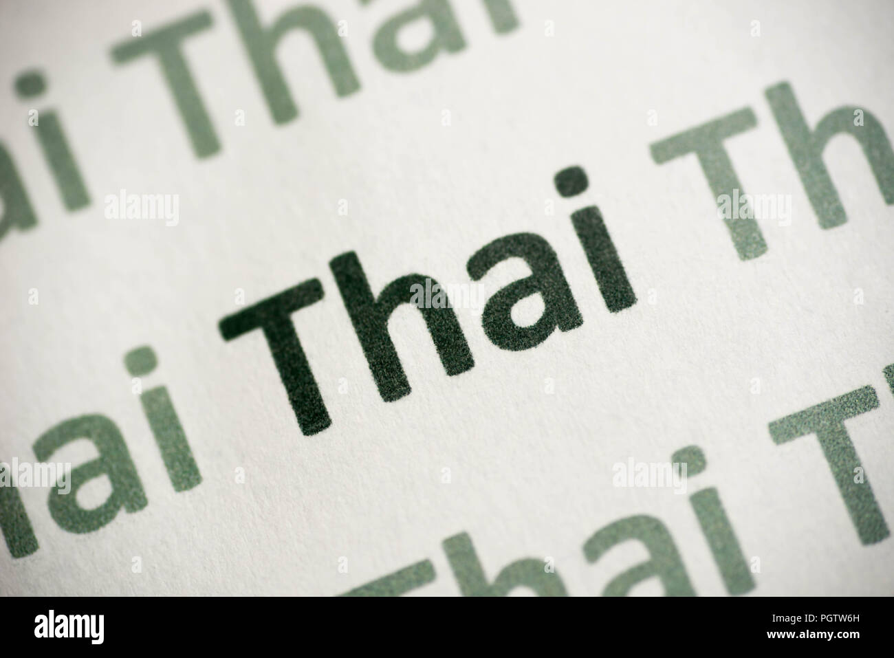word Thai language printed on white paper macro Stock Photo