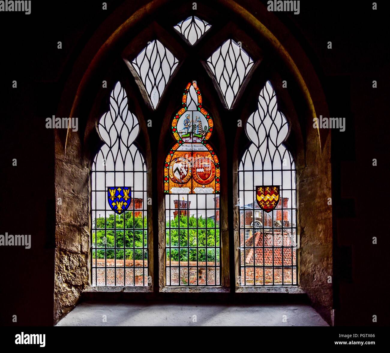 Stained glass window dedicated to Sir Roger de Somervile and his wife Maud. Stock Photo