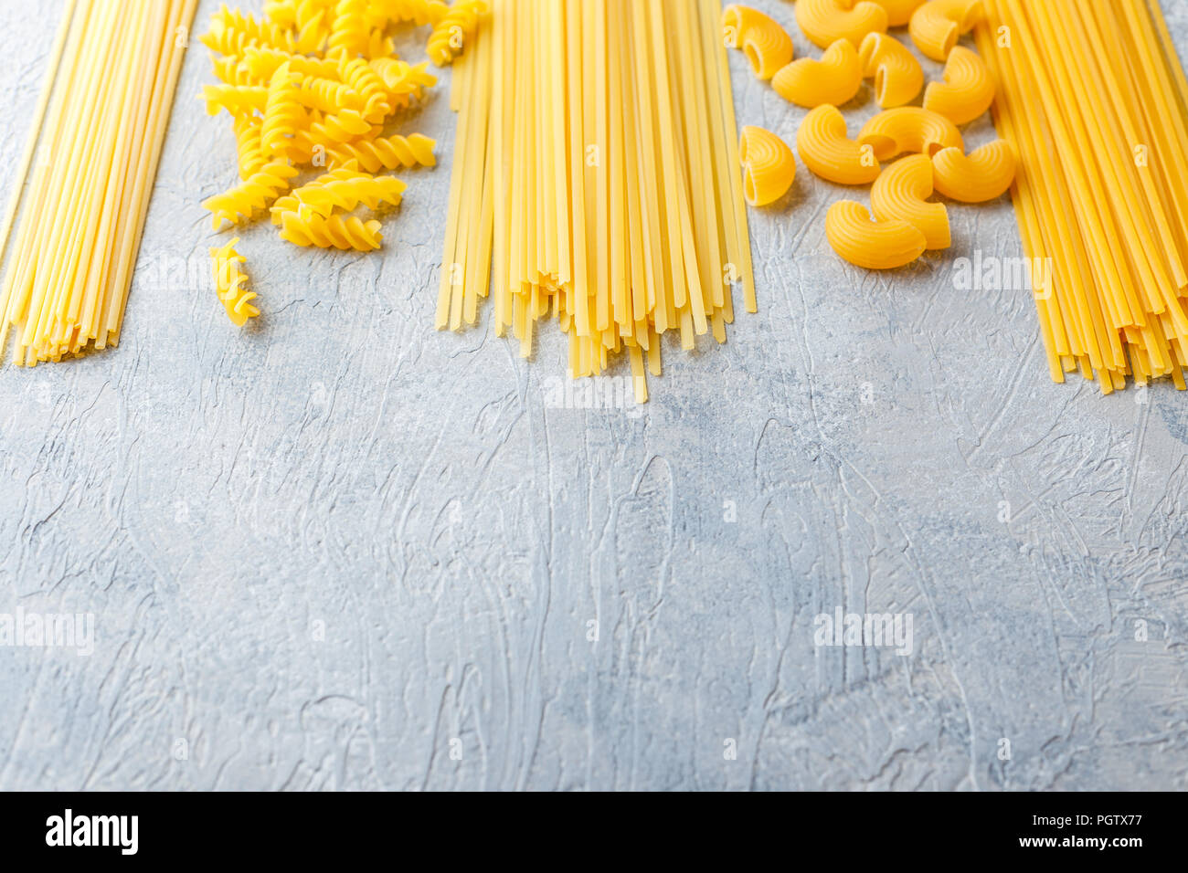 Variety of types and shapes of dry Italian pasta Spaghetti, Linguine
