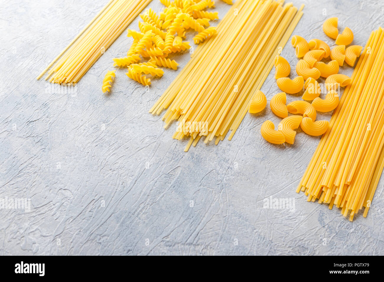 Variety Of Types And Shapes Of Dry Italian Pasta Spaghetti Linguine Conchiglie Elbow Macaroni Fusilli Stock Photo Alamy