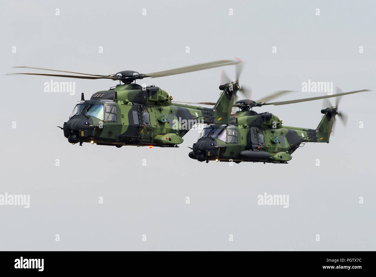 Two NHIndustries NH90 TTH military helicopters from the Utti Jaeger Regiment of the Finnish Army. Stock Photo