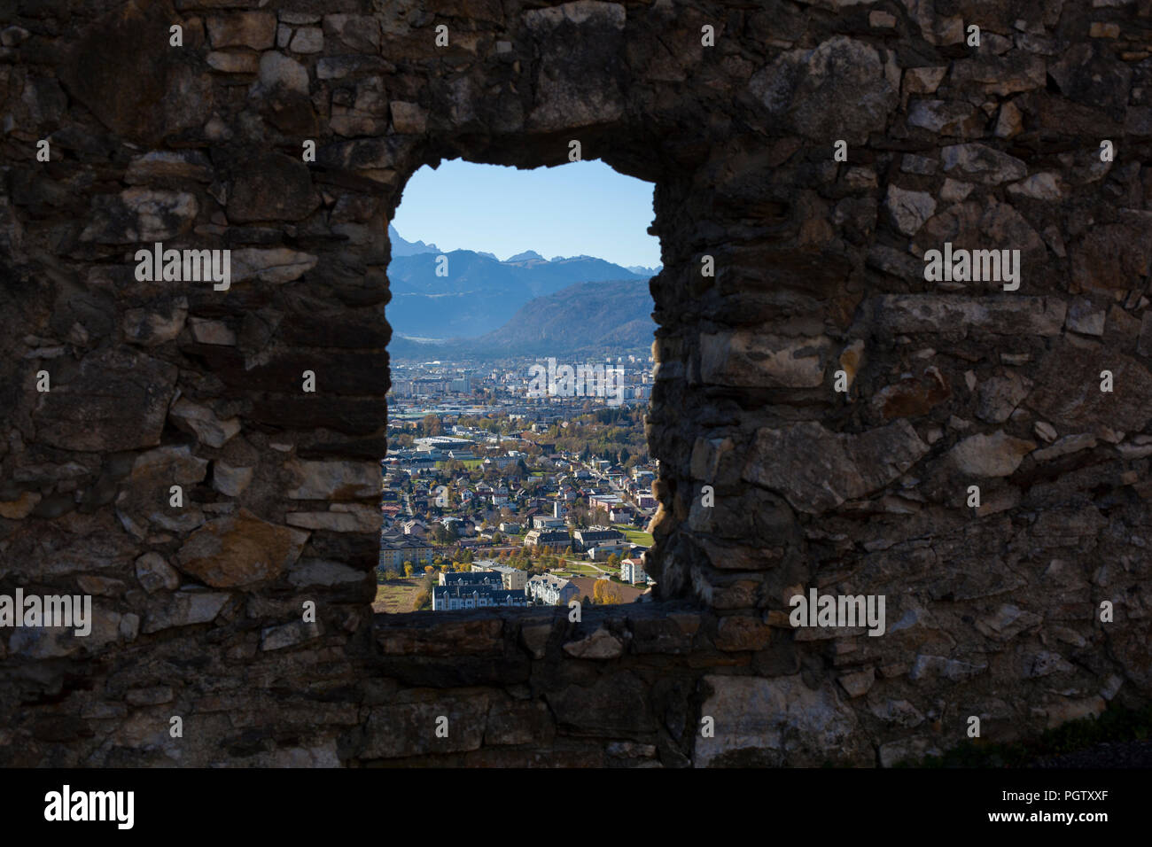 A view to the city of Villach throug the window of Burg Landskron castle Stock Photo